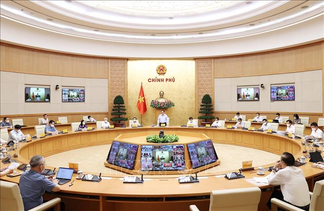 Thủ tướng Phạm Minh Chính chủ trì làm việc giữa BCĐ Quốc gia phòng, chống dịch COVID-19 với các địa phương - Ảnh: Dương Giang/TTXVN